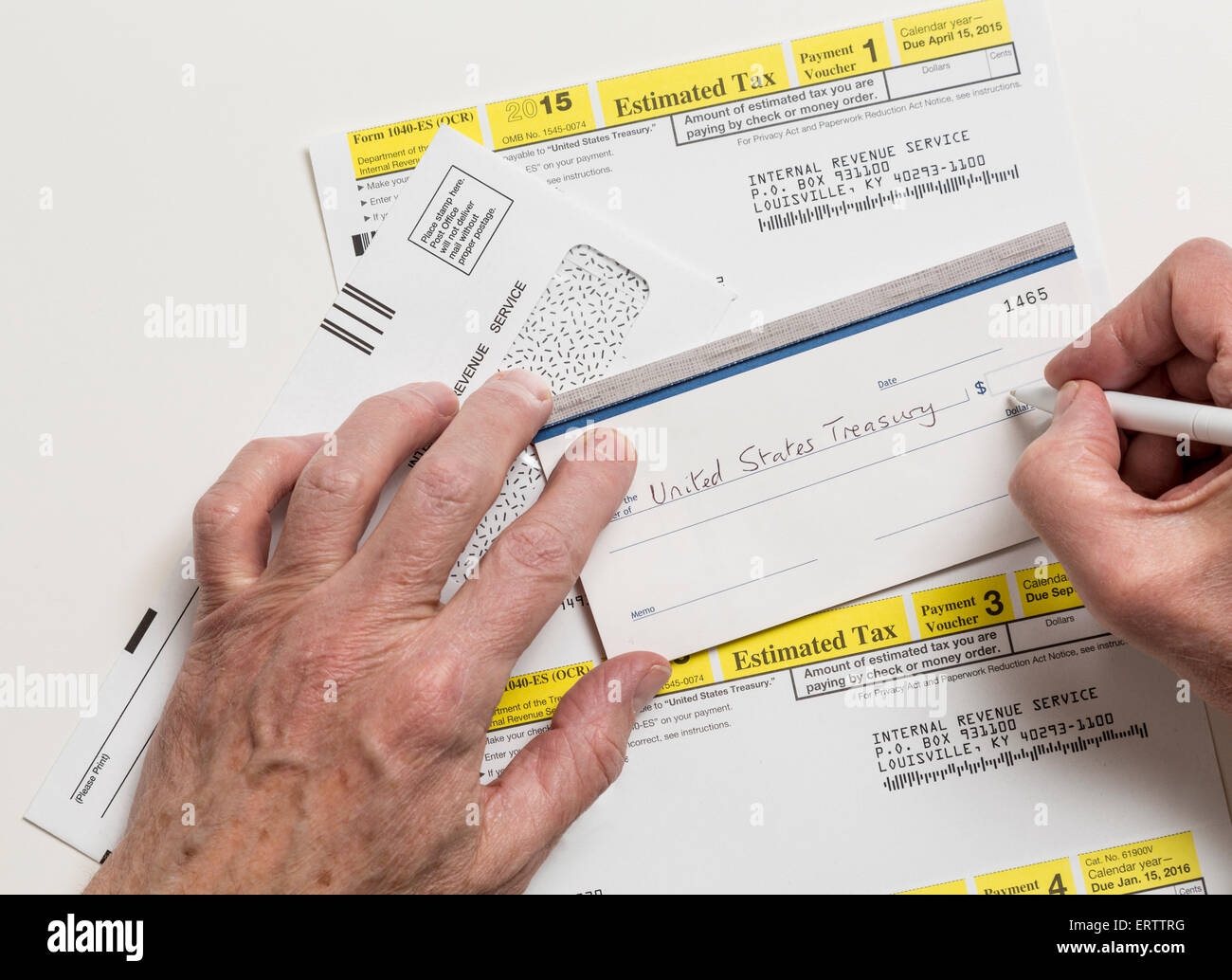 Man Writing Check To Internal Revenue Service IRS Form 1040 ES For Payment Of Estimated Taxes In 2015 Stock Photo Alamy